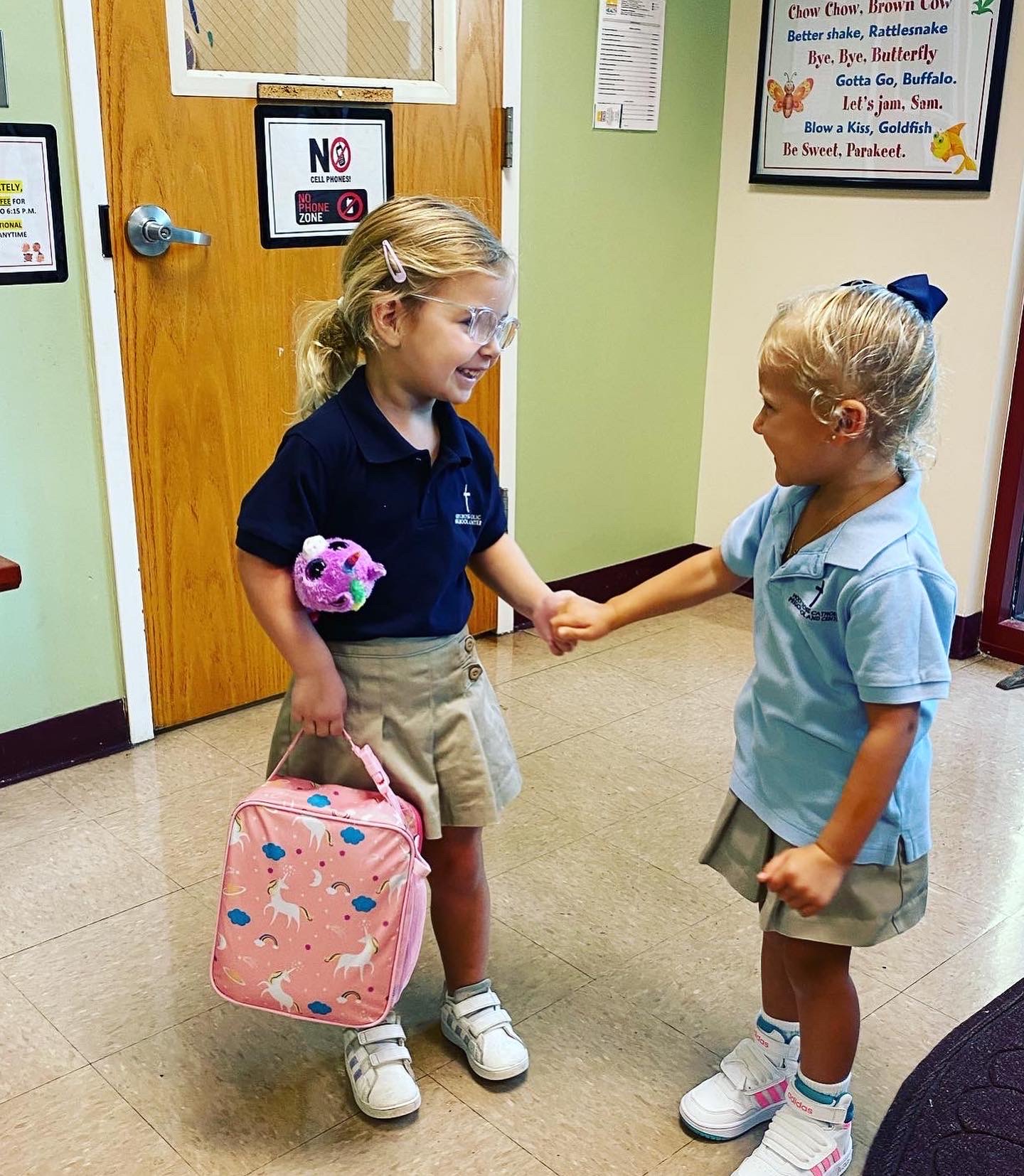 holycross-two-kids-holding-hands-alt