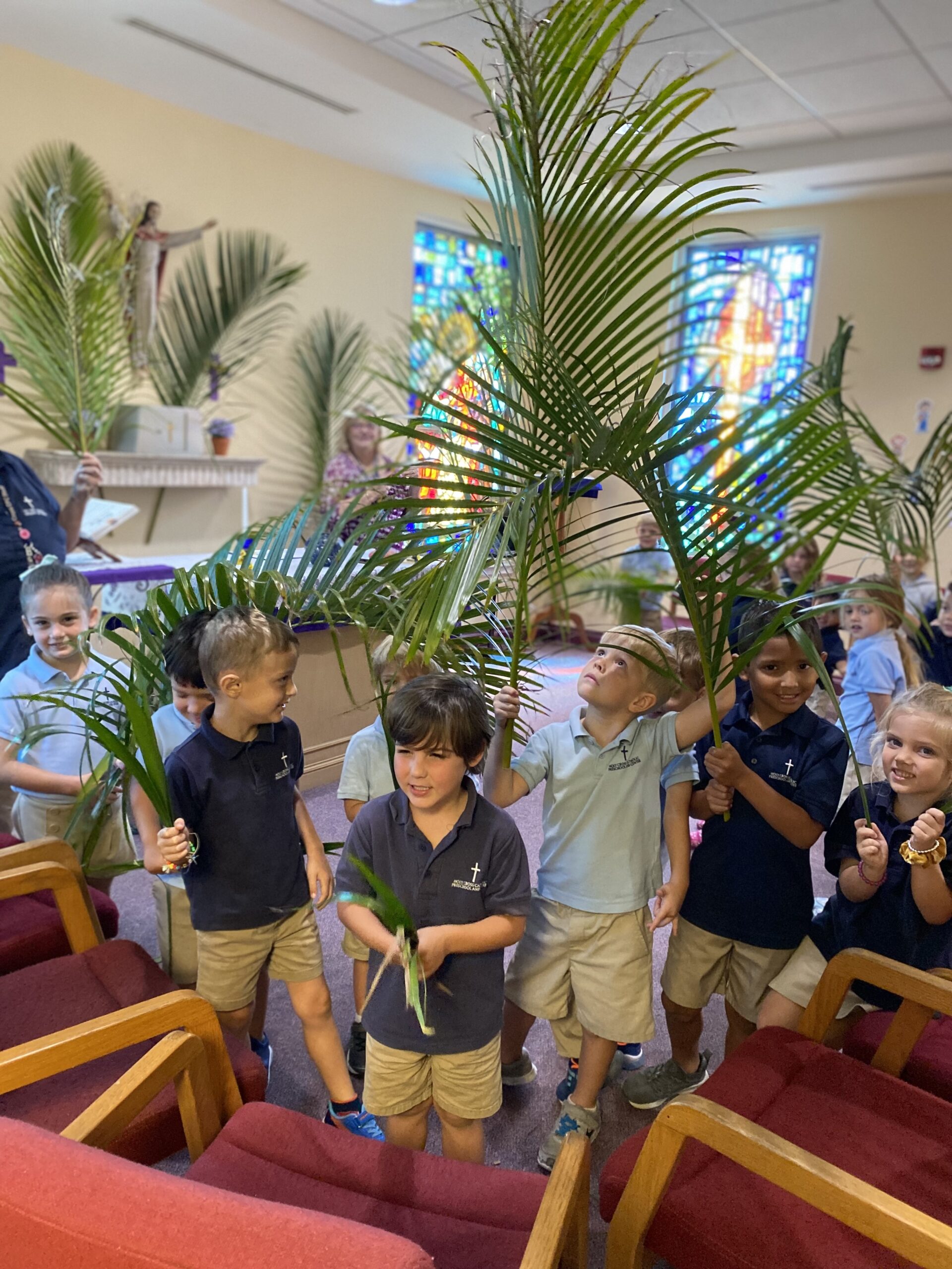 kids-in-church-holding-palm-fronds